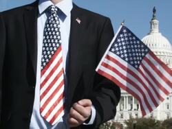 CU SLO MO Man wearing American flag tie and holding flag / Washington, DC, USA Stock Footage