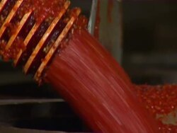 Close up of tabasco flowing from tube into barrel. Stock Footage