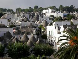 Trulli houses in Aiberobello a tratitional dry stone hut with conical roof, Puglia, Southern Italy, Europe Stock Footage