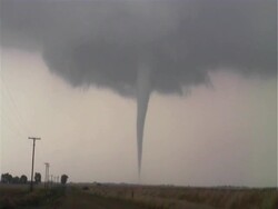 Long slender tornado Harper, Kansas, zooms in to base of funnel and debris cloud, WA, USA Stock Footage