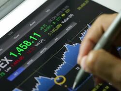 Businessman using Tablet analysis stock data. Stock Footage