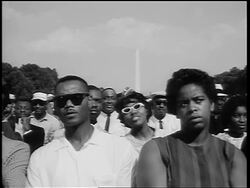 B/W August 28, 1963 Black crowd watching Marian Anderson sing / Washington Monument in background Stock Footage