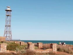 WS PAN View of Gantheaume Point lighthouse while people in background / Broome, Western Australia, Australia Stock Footage