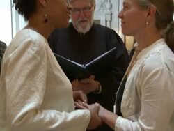 MS Female couple reciting wedding vows at San Francisco City Hall/ ZI CU Woman putting ring on partner's finger/ San Francisco, California/ AUDIO Stock Footage