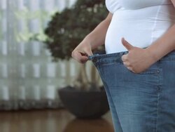 HD DOLLY: Showing How Much Weight She Lost Stock Footage