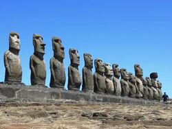 Hd video of a man walking close to moais Stock Footage