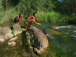 Bush people at a river Stock Footage