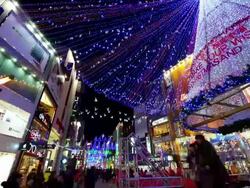 MS T/L Shot of People and neon advertisements in Christmas Nampo dong at Night / Busan, South Korea  Stock Footage