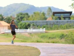 Woman jogging in park Stock Footage