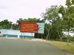 MS POV Shot of Political quote billboard / Cuba Stock Footage