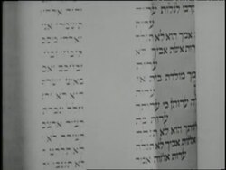 A rabbi opens an ark to read a Torah scroll written in Hebrew. News Clip