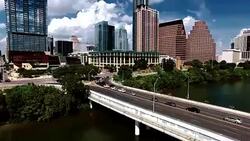 Austin Texas High Contrast Downtown Skyline Flying low near Congress Avenue Bridge closer to downtown Stock Footage