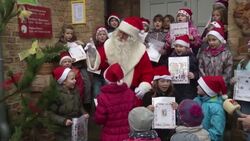 Santa Claus opens a post office in Himmelpfort to the delight of waiting children News Clip