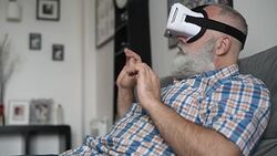 adult senior man and a virtual reality headset. graybearded man using vr glasses Stock Footage