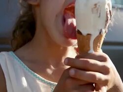 Girl eating an ice cream cone Stock Footage