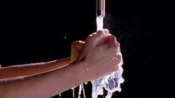 Close up slow motion of a womanï¿½??s hands clasp and wash in water running from a faucet. Stock Footage