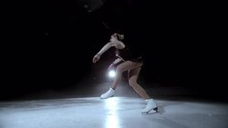 SLO MO DS Elegant female figure skater performing a jump Stock Footage