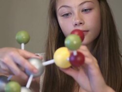 Teen Female Student Studies Science Project - Close Up Stock Footage