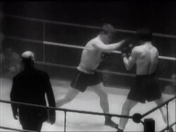 SPORT: BOXING - MILLS NARROW VICTORY News Clip