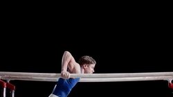 SLO MO Gymnast performing on parallel bars Stock Footage