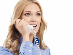 Woman smiling, speaking on phone, showing okay gesture Stock Footage