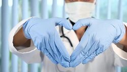 Female surgeon showing heart shape with hands Stock Footage