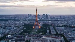 Elevated view of the Eiffel Tower, city skyline and La Defence skyscrapper district in the distance, Paris, France, Europe - Time lapse Stock Footage