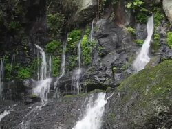 HD: Water falling on rocks below (video) Stock Footage