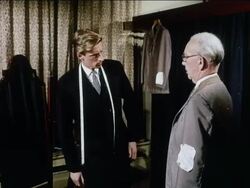 Savile Row, city of Westminster, London.  Tailor fitting suit, England, UK.  1963 Stock Footage