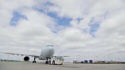 Airplane towed before takeoff at airport Stock Footage