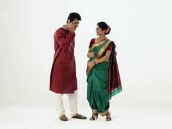 Marathi couple talking on a mobile phone  Stock Footage