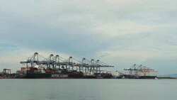 Industrial port with containers ship in the harbor Stock Footage