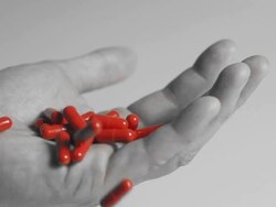 HD SLOW MOTION: Taking Red Capsules Stock Footage