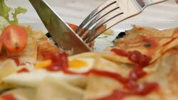 eating spinach pie with sauce close up Stock Footage