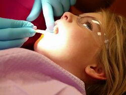 MS Young girl sitting in dentist chair / Lamy, New Mexico, United States Stock Footage