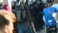 Riot police firing water canon at protesters News Clip