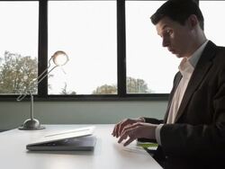 Stop Motion Track shot of businessman unable to keep his laptop close to him Stock Footage
