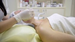 Beautician applying face mask Stock Footage