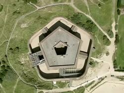 MS AERIAL DS ZO View of Napoleonic Fort at Ostend beach / Flanders, Belgium Stock Footage