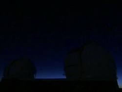 Low Angle static _ Light dims over the Mauna Kea observatory dome / Mauna Kea, Hawaii, USA Stock Footage