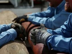MS R/F TD Worker talk and lean on power poles / Hooker,  OK, United States Stock Footage