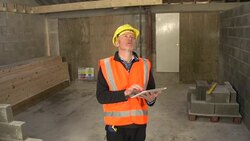 Builder / Inspector using Digital Tablet on Construction / Building site : CRANE Stock Footage