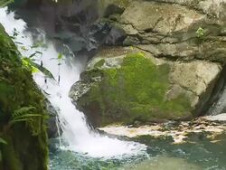 HD SLOW MOTION: Beautiful Waterfall Crashing Against The Rocks Stock Footage