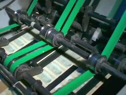 CU, Sheets of American ten dollar bills traveling on conveyer, Washington DC, USA Stock Footage