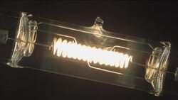 A quartz lamp filament lights up then gradually goes out. Stock Footage