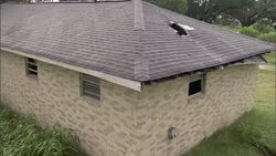 A damaged house sits abandoned after a flood in New Orleans. Stock Footage