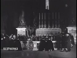 1940: VATICAN CITY: SAINT PETER'S BASILICA: XWS People gathered around Papal Altar & Baldacchino. CONFESSIO: People gathered around Tomb of St. Peter (behind Niche of Pallium). VS Tomb exterior. People kneeling in prayer. Instructional Video