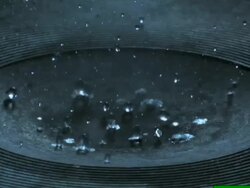 Water drips onto a hot plate Stock Footage