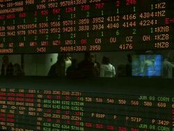CU Shot of stock exchange data display board with people visible through narrow window / Chicago stock market, Michigan, United States Stock Footage