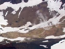 MS AERIAL View of snowy mountain at Cinder cone on lava plain / Iceland Stock Footage